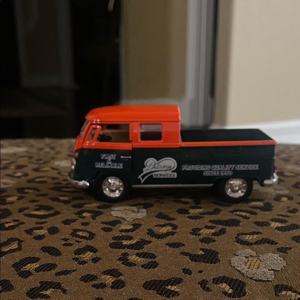Vintage Diecast Model Van with Red and Black Design